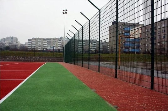Fencing of sports grounds with welded mesh
